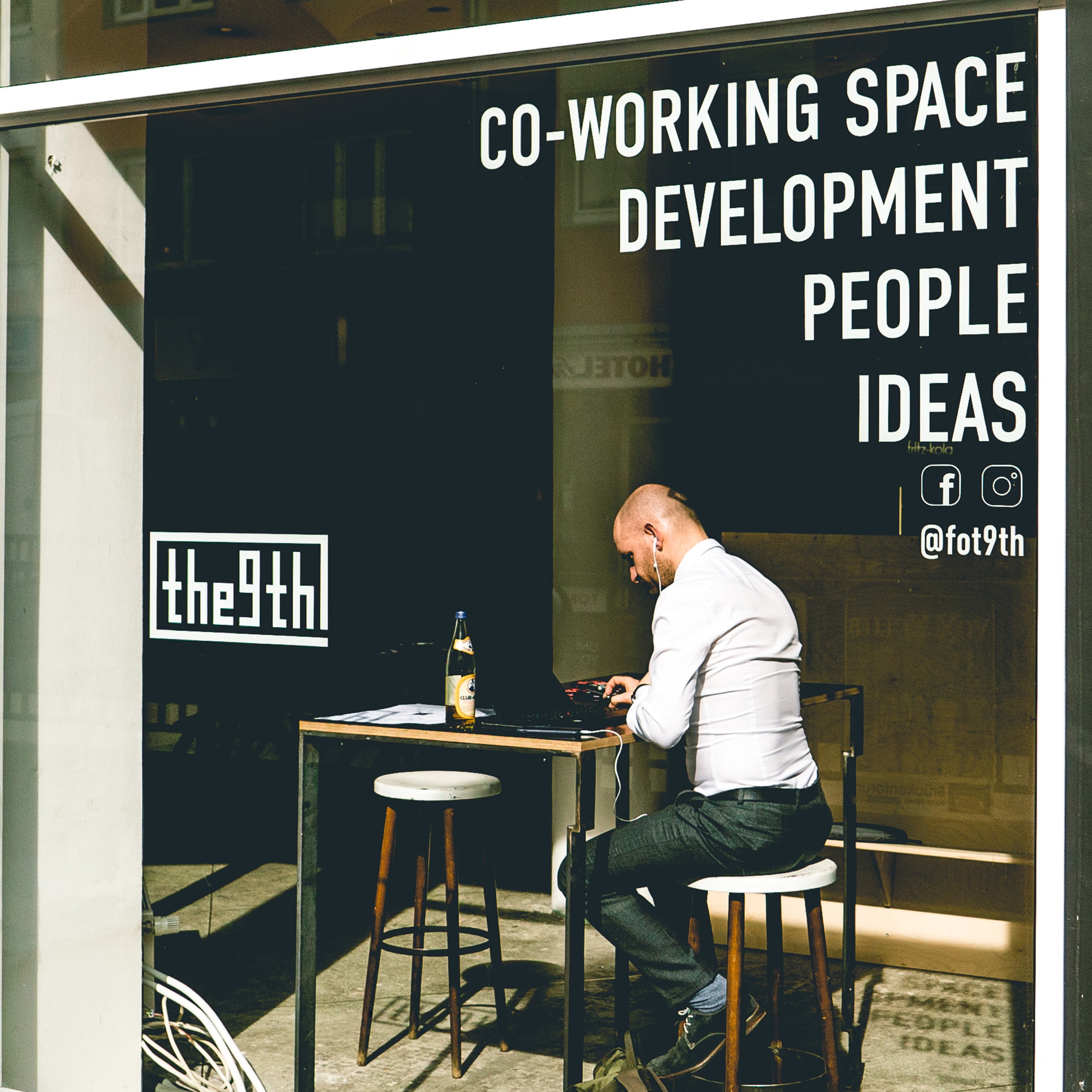 man sitting outside at cafe